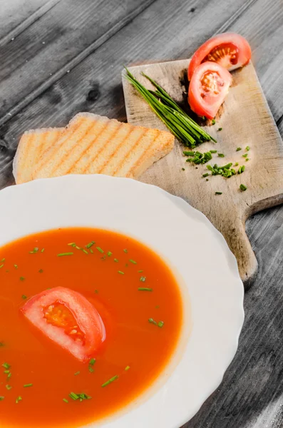 Tomato soup with toast and chive — Stock Photo, Image