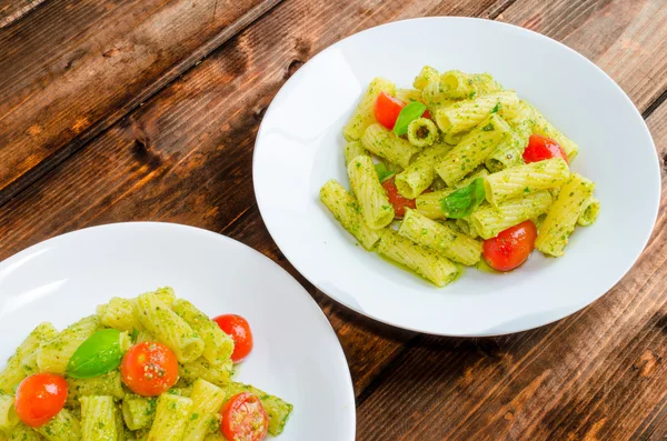 Rigatoni pasta with genoese pesto and sherry tomato — Stock Photo, Image