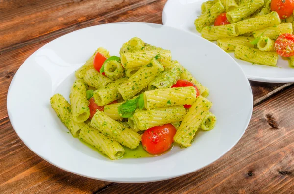 Rigatoni pasta with genoese pesto and sherry tomato — Stock Photo, Image