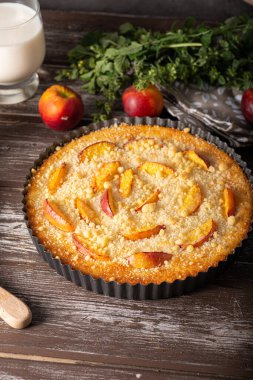 Nectarine tart with sugar and fresh mint