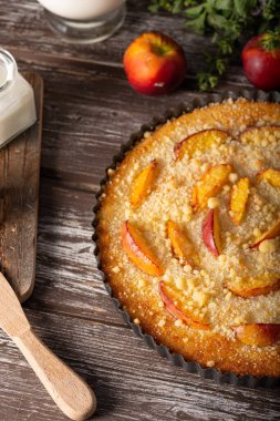 Nectarine tart with sugar and fresh mint