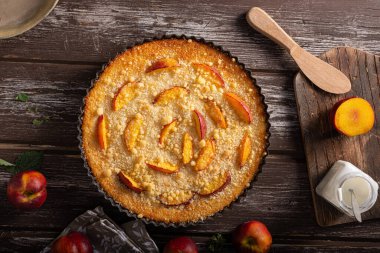 Nectarine tart with sugar and fresh mint