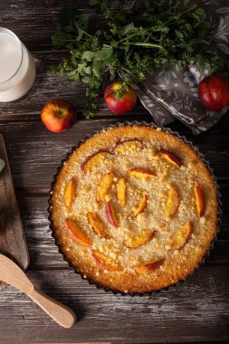 Nectarine tart with sugar and fresh mint