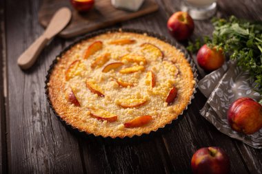 Nectarine tart with sugar and fresh mint