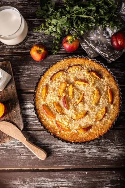 Nectarine tart with sugar and fresh mint