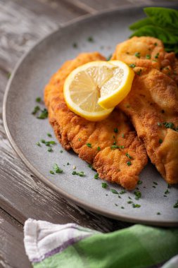 Delicious and simple schnitzel with french fries and garlic sauce