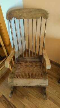 detail of an old style wooden rocking chair used by grandmothers concept furniture