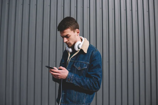 Side View Young Ethnic Concentrated Male Denim Jacket Headphones Browsing — Stock Photo, Image