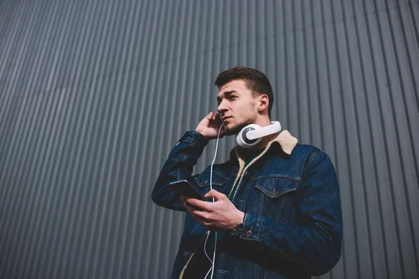 Serious Man Jean Jacket Headphones Looking Away While Listening Music — Stock Photo, Image