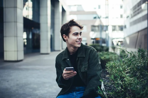 Satisfied Male Casual Clothes Toothy Smile Looking Away While Sitting — Stock Photo, Image