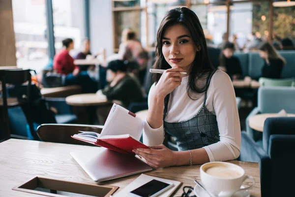 Young Glad Female Student Casual Clothes Looking Camera While Sitting — Stock Photo, Image