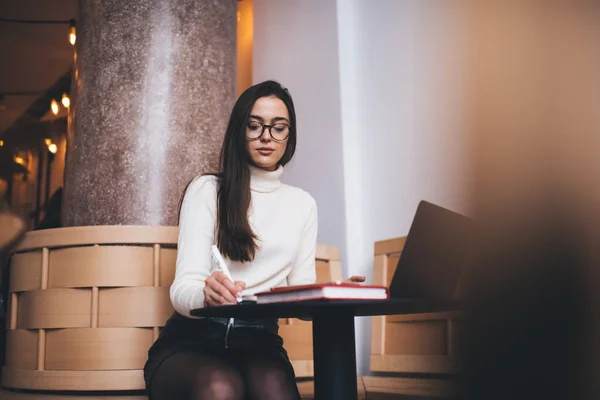 Content Female Freelancer Stylish Wear Taking Notes Copybook While Working — Stock Photo, Image