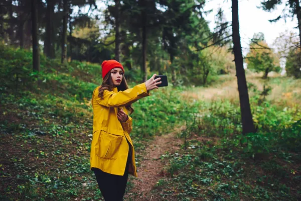 Calm Young Female Yellow Raincoat Hat Red Lips Looking Screen — Stock Photo, Image
