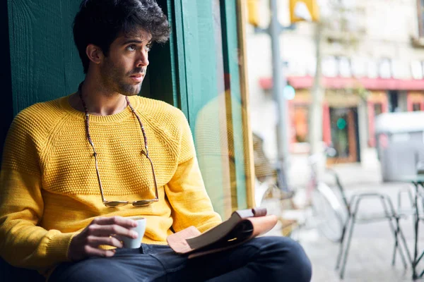 Thoughtful Bristled Male Casual Outfit Eyeglasses Chain Drinking Beverage Reading — Stock Photo, Image