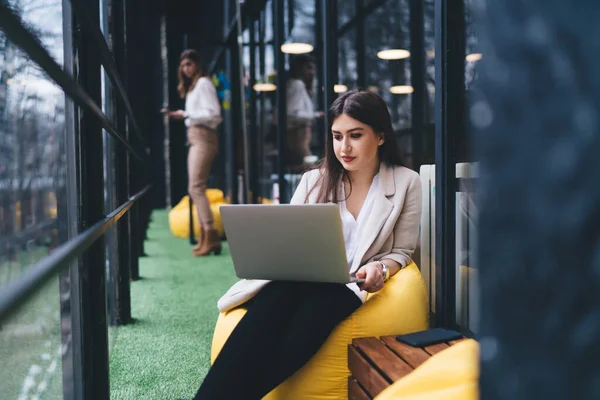 Pensive Female Entrepreneur Casual Wear Typing Laptop Keyboard While Working — Stock fotografie