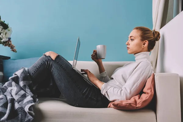Side View Calm Woman Lying Sofa Cup Coffee Watching Video — Stock Photo, Image