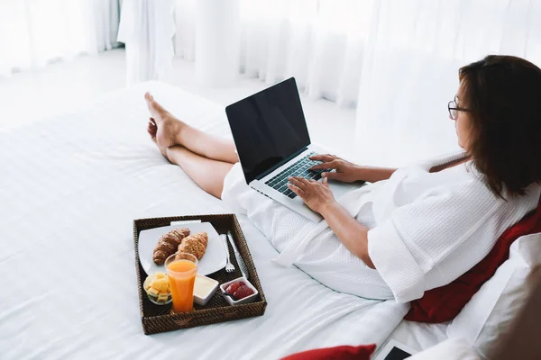 Unrecognizable Young Female Bathrobe Typing Laptop While Lying Bed Morning — Stock Photo, Image