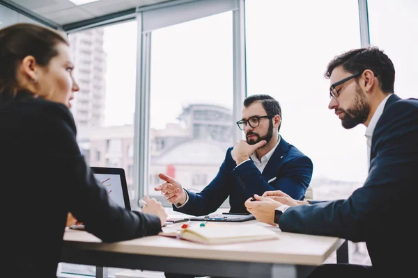 Thoughtful Business People Formal Clothes Sitting Table Using Laptop Presentation — Stockfoto