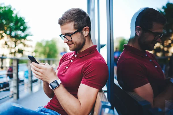Side View Happy Young Man Wearing Eyeglasses Smart Watch Sitting — Stock Photo, Image