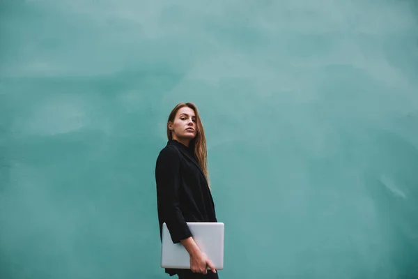 Young Serious Female Casual Black Clothes Looking Camera Holding Laptop — Stock Photo, Image