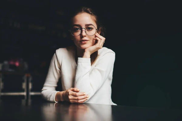 Thoughtful Young Female White Jumper Eyeglasses Sitting Table Thoughtfully Looking — Fotografia de Stock