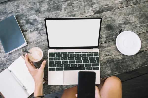 Crop Anonymous Lady Browsing Smartphone Working Laptop While Sitting Wooden — Stock Photo, Image