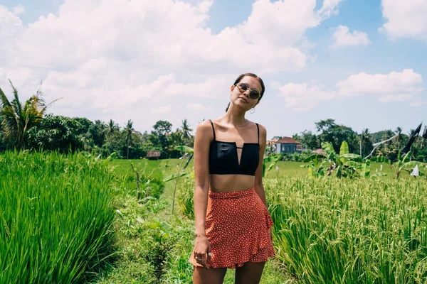 Confident Young Fit Ethnic Female Traveler Trendy Outfit Sunglasses Standing — Stockfoto