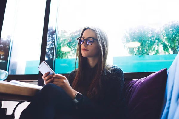 Young Pensive Female Long Hair Eyeglasses Sitting Table Comfortable Pose — Foto Stock