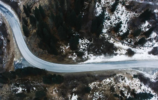 Drone View Straight Asphalt Road Going Snowy Terrain Forest Evergreen — стокове фото