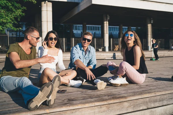Stylish Friends Modern Sunglasses Resting Laughing Together While Sitting Legs — Fotografia de Stock