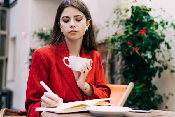 Young Female Stylish Clothes Cup Coffee Writing Notes While Sitting — Stock Photo, Image