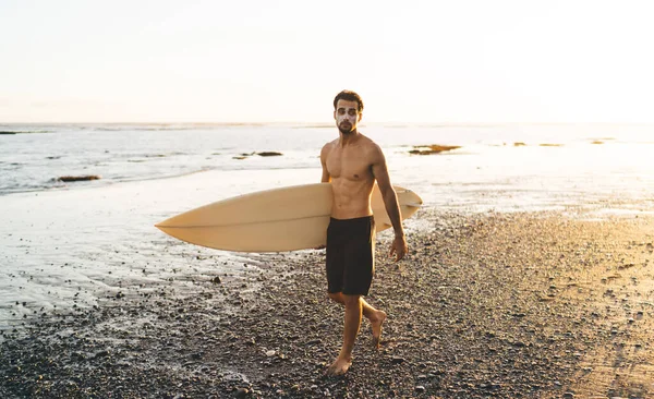 Thoughtful Male Years Old Walking Water Edge Spending Day Surfing — стоковое фото