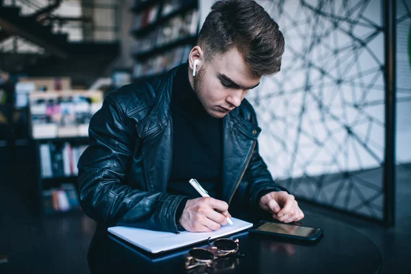 Young Man Leather Jacket Trendy Haircut Using Mobile Phone Writing — 图库照片