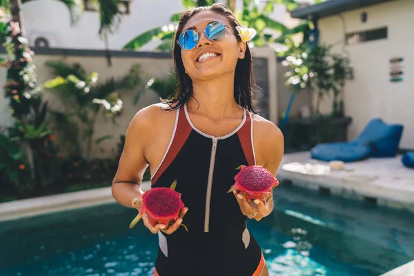 Cheerful Slim Lady Wet Hair Sunglasses Swimwear Standing Pitaya Swimming — Stockfoto