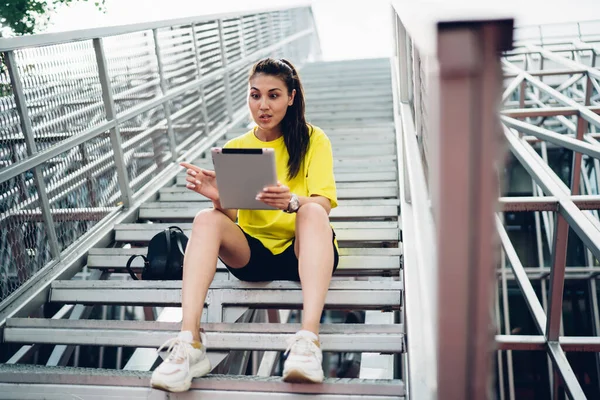 Smiling Surprised Asian Woman Influencer Using Digital Tablet Downloading Application — Stockfoto