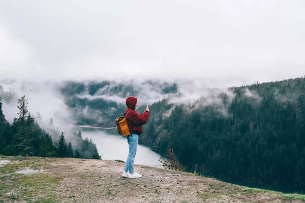 Side View Anonymous Tourist Hood Shooting Photos Magnificent Mountains Located — стокове фото