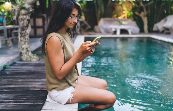 Side View Ethnic Female Eyeglasses Sitting Edge Swimming Pool While — Fotografia de Stock