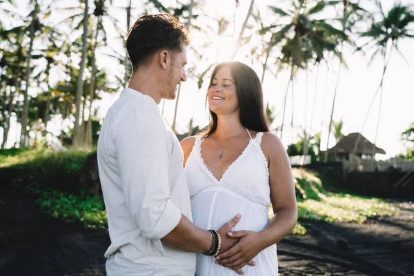 Cheerful Pregnant Couple Standing Close Caressing Gently While Spending Summer — Stock Photo, Image