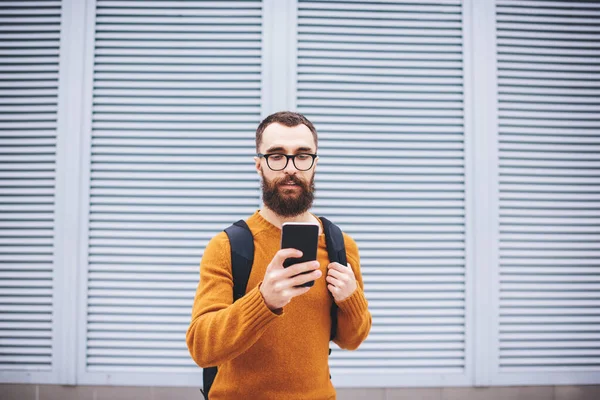 Handsome Young Bearded Hipster Trendy Wear Eyeglasses Backpack Dialing Number — Foto Stock