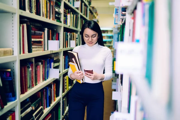 Young Asian Cheerful Female Student Colorful Notebooks Glasses Walking Bookcases — 图库照片