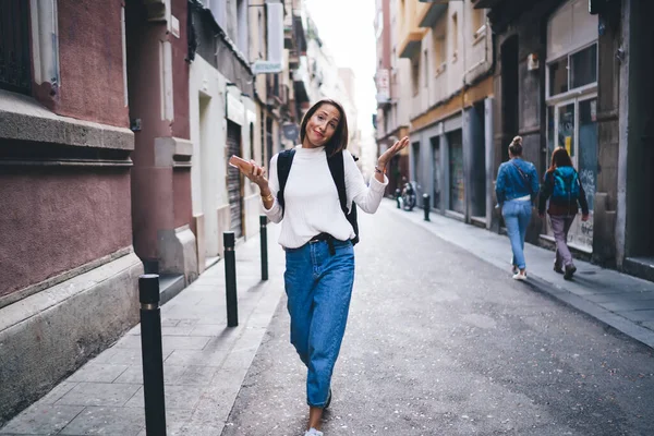 Full Length Portrait Puzzled Woman Walking City Street Looking Camera — стоковое фото