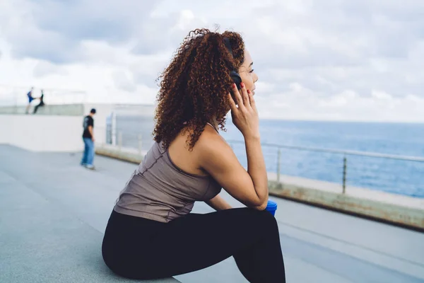 Rear View Curly Female Jogger Headphones Recreating Cardio Training City — Stockfoto