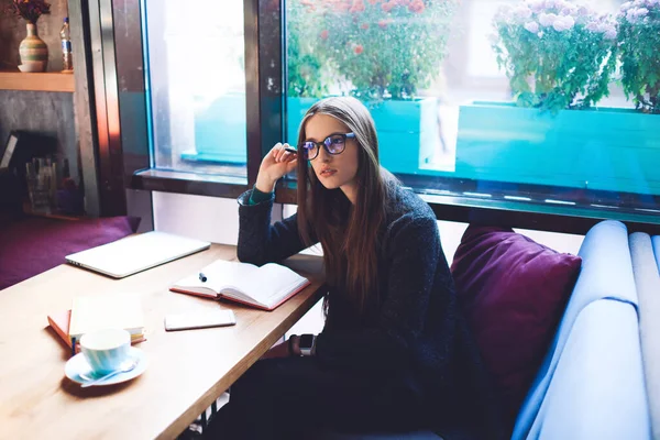 Thoughtful Female Freelancer Casual Outfit Looking Away Sitting Table Window — Foto Stock