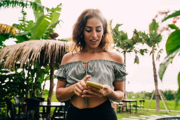 Young Good Looking Hispanic Woman Crop Top Looking Smartphone Screen — Fotografia de Stock