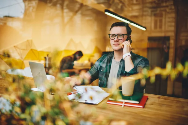 Glass Thoughtful Male Freelancer Looking Away Sitting Table Browsing Laptop — Foto Stock