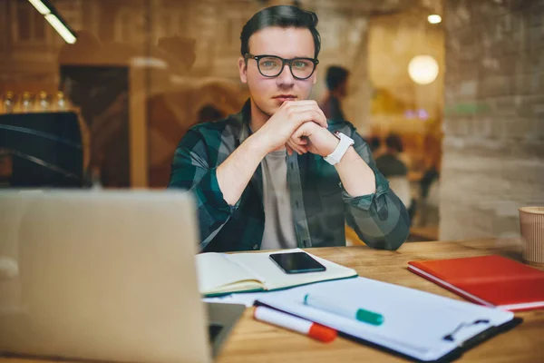 Glass Pensive Male Freelancer Casual Clothes Looking Camera Clasped Hands — Fotografie, imagine de stoc