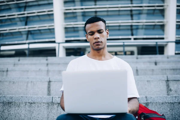 Serious Black Male Freelancer Casual Outfit Concentrating Working Laptop Remotely — Fotografia de Stock