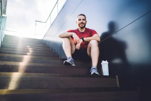 Low Angle Cheerful Bearded Male Sitting Wall Urban Building Bottle — Foto de Stock