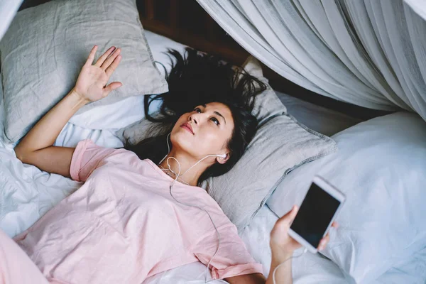 Millennial Hipster Girl Sleepwear Lying Homey Bead Listening Audio Book — Fotografia de Stock