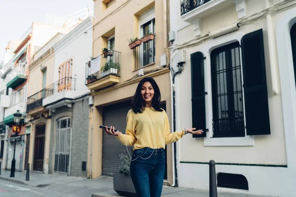 Positive Ethnic Female Casual Clothes Smiling Walking Narrow Street While — Zdjęcie stockowe